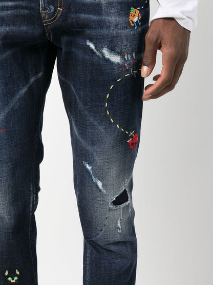 illustrated distressed skinny jeans