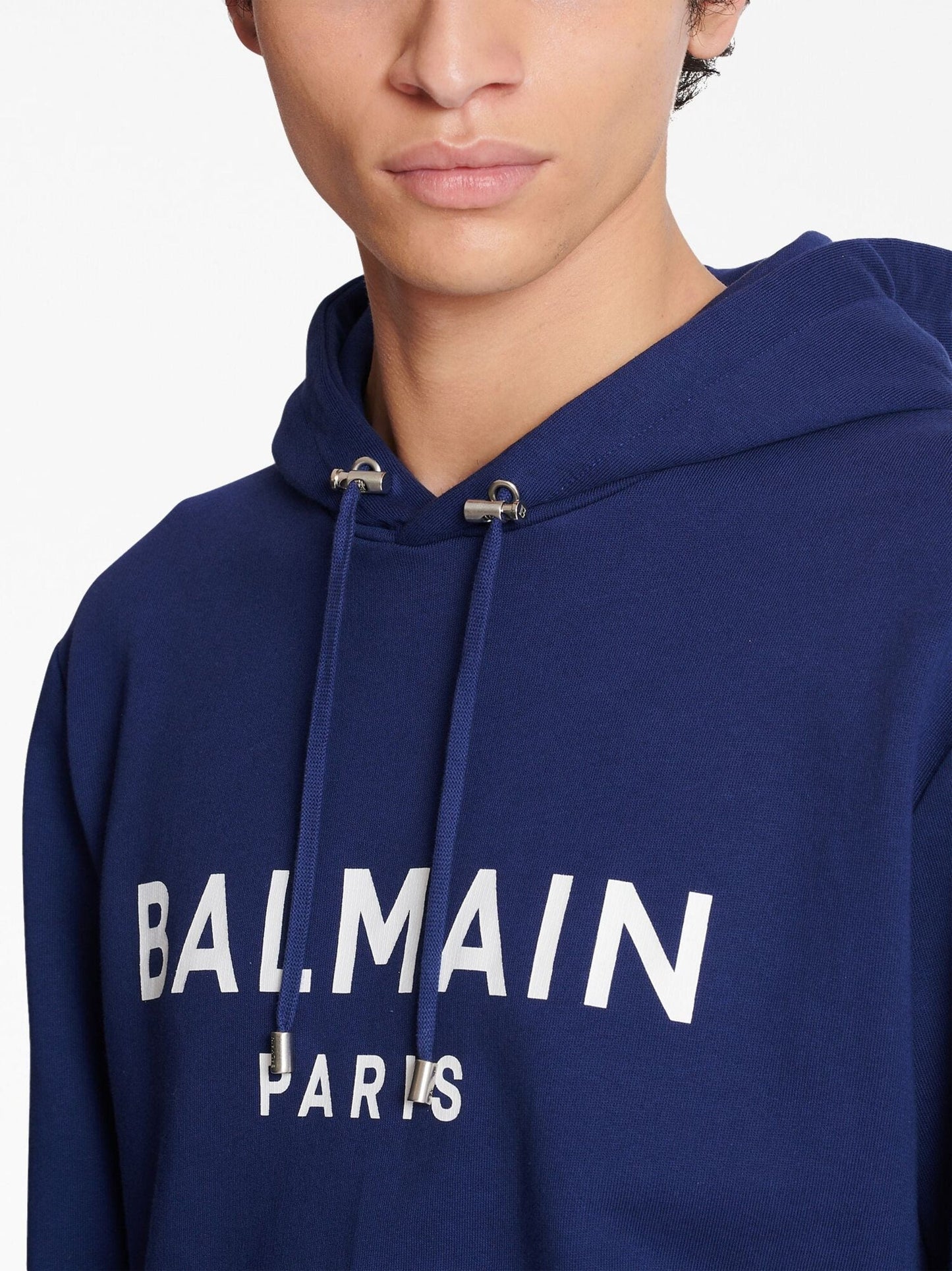 logo print long sleeved hoodie by balmain - bottegalusso: premier destination for modern luxury menswear